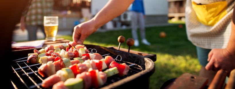 Skewered veggies being grilled