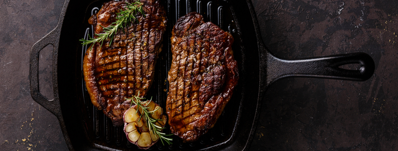 Grilled steak on a cast iron pan